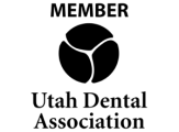 Utah Dental Association member logo featuring stylized tooth design and organization name.