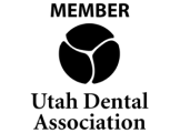 Utah Dental Association member logo featuring stylized tooth design and organization name.
